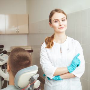 Female Dentist standing relaxed after dental treatment